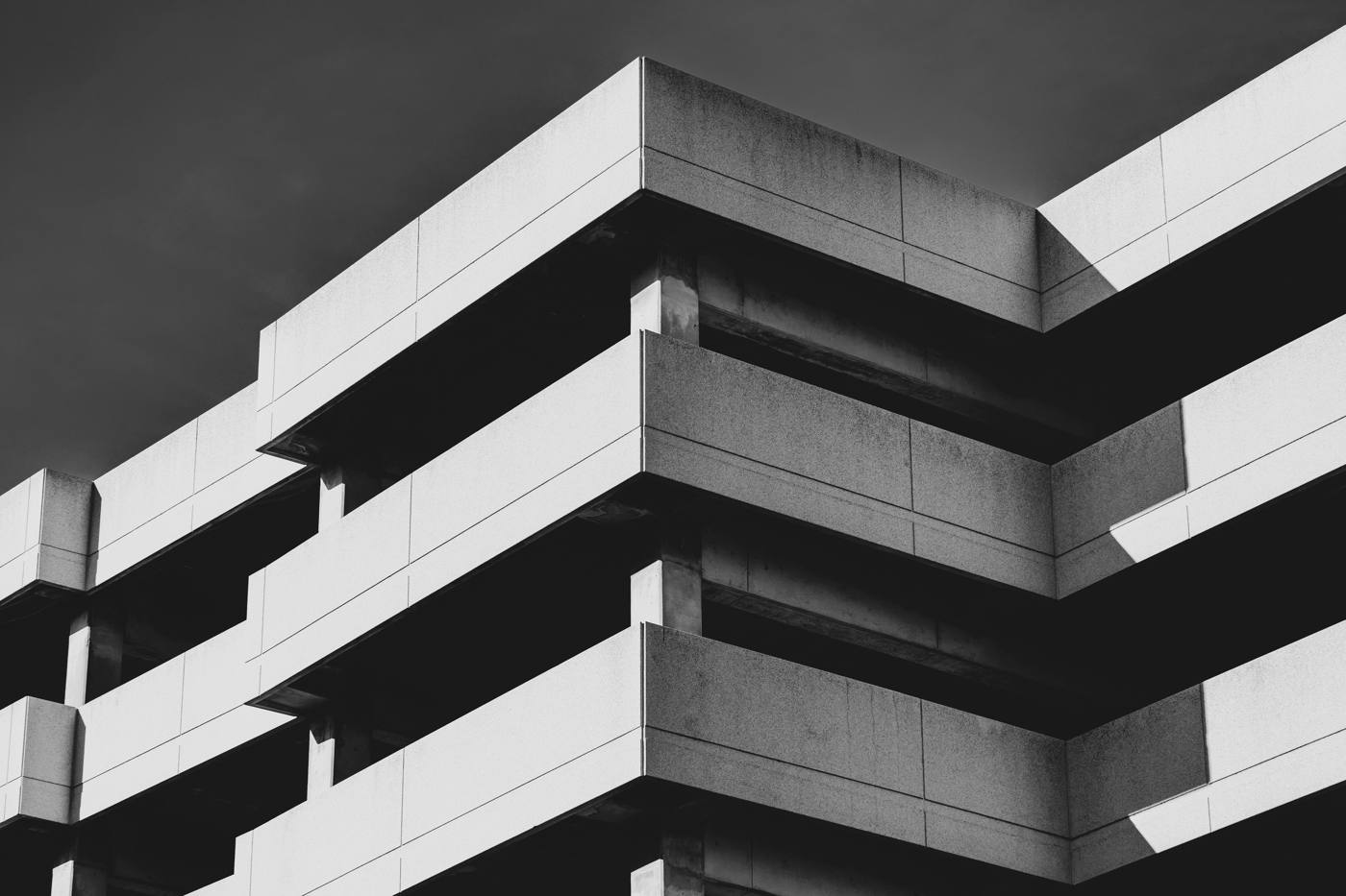 Concrete building with layered horizontal balconies